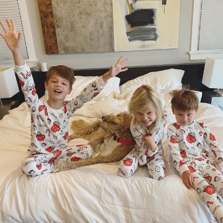 Camden John Lachey with his siblings in matching pajamas.